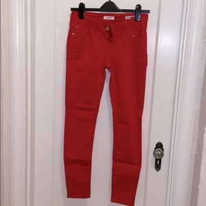 Bright red skinny jeans